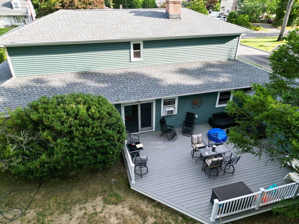 Looking,down,at,backyard,with,a,composite,deck,on,a