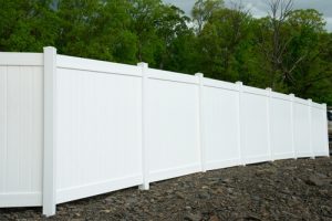 White,vinyl,fence,fencing,of,private,property,grass,plastic