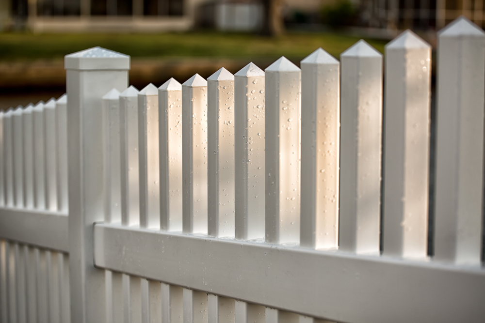Vinyl,picket,fence,with,water,drops