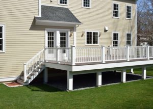 New,composite,deck.,white,veranda,and,railing,posts,,brown,boards,